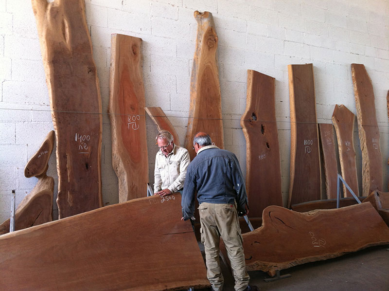 Gary and Micah measure eucalyptus slabs to select just the right pieces