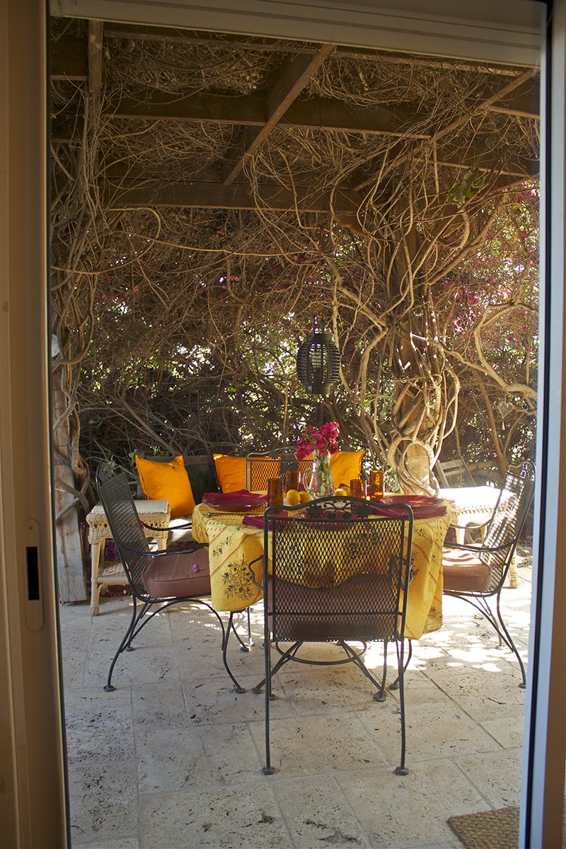 A seat at the table awaits, but the sliding glass door is a barrier