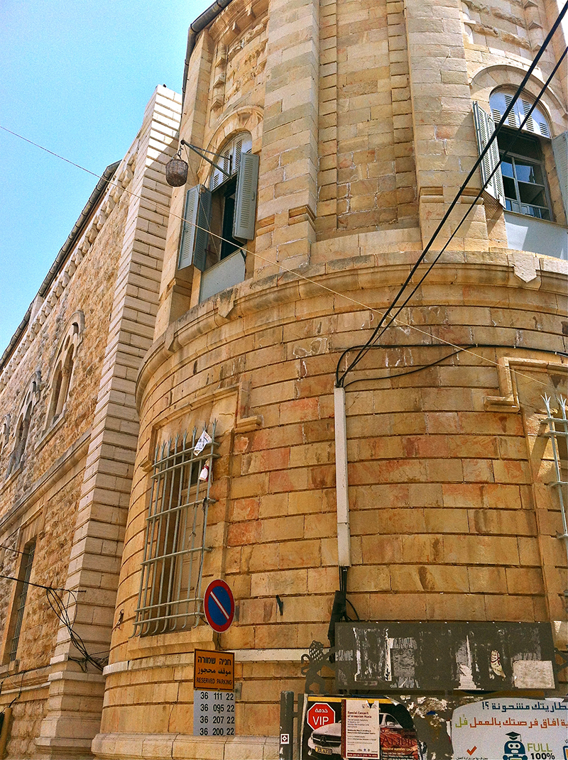 The Old City resident of this upper floor apartment has windows open and a basket on a pulley ready to receive